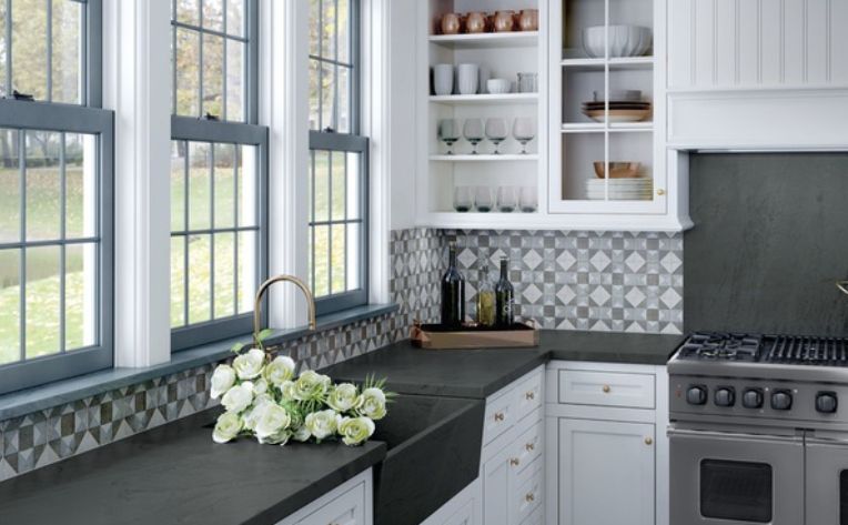 blue and white mosaic tile backsplash in kitchen